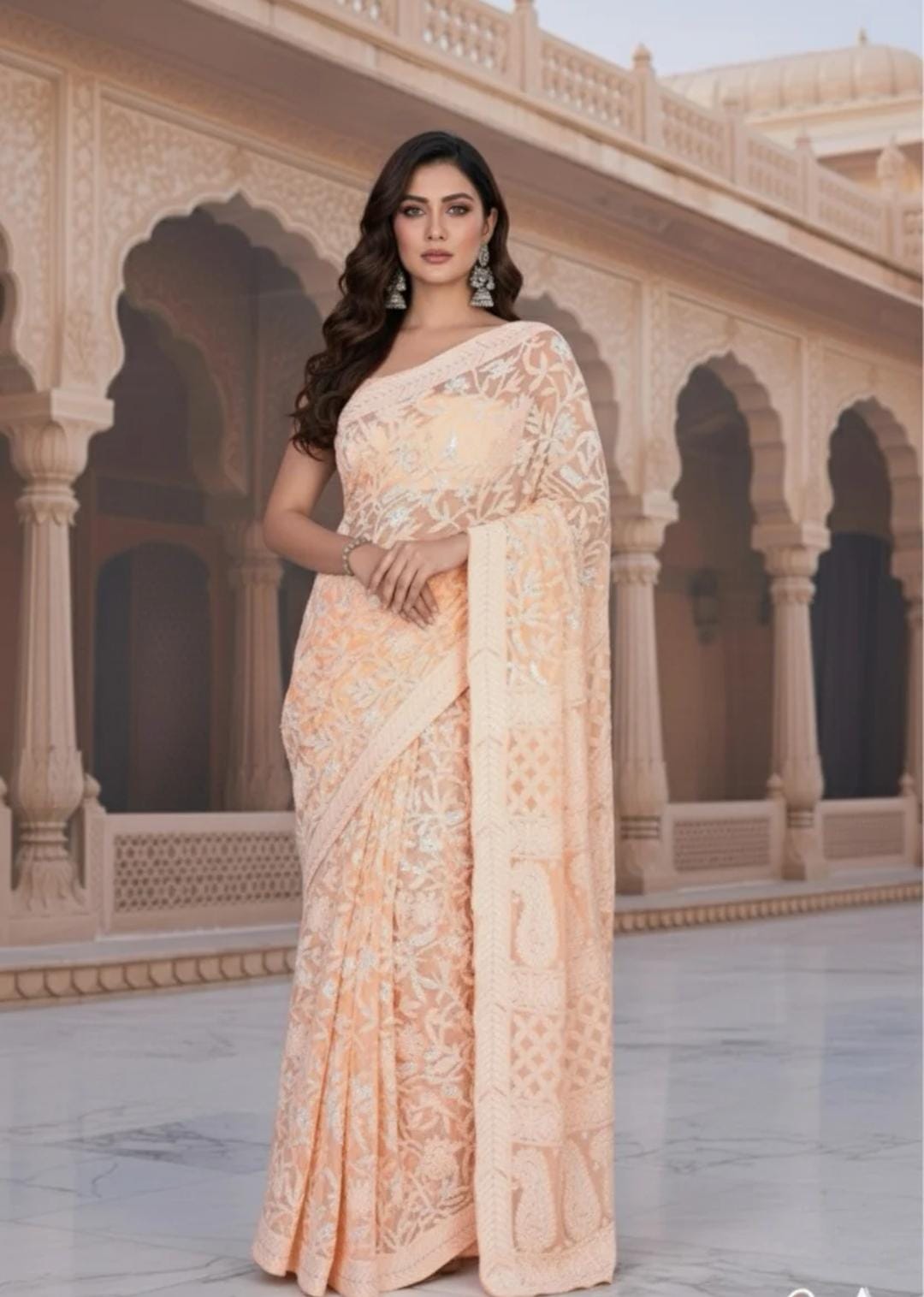 Pure Opulence Draped in Exquisite Peach Chikankari Craftsmanship Saree